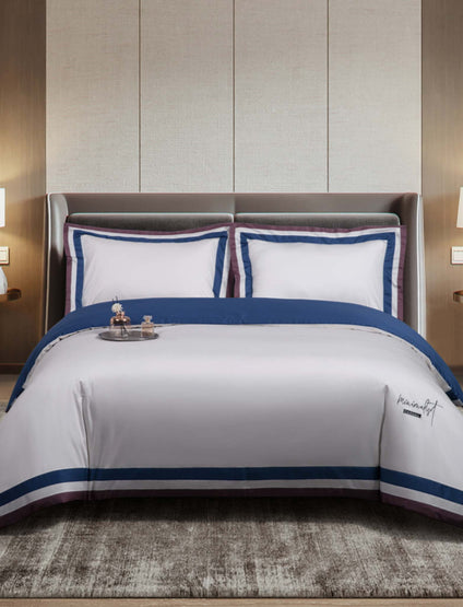 Aulaire 60s 3-piece Duvet Cover and Pillowcase Set. Signature Collection Long Staple Cotton. White top with dark blue and brown border. Dark blue underside.
